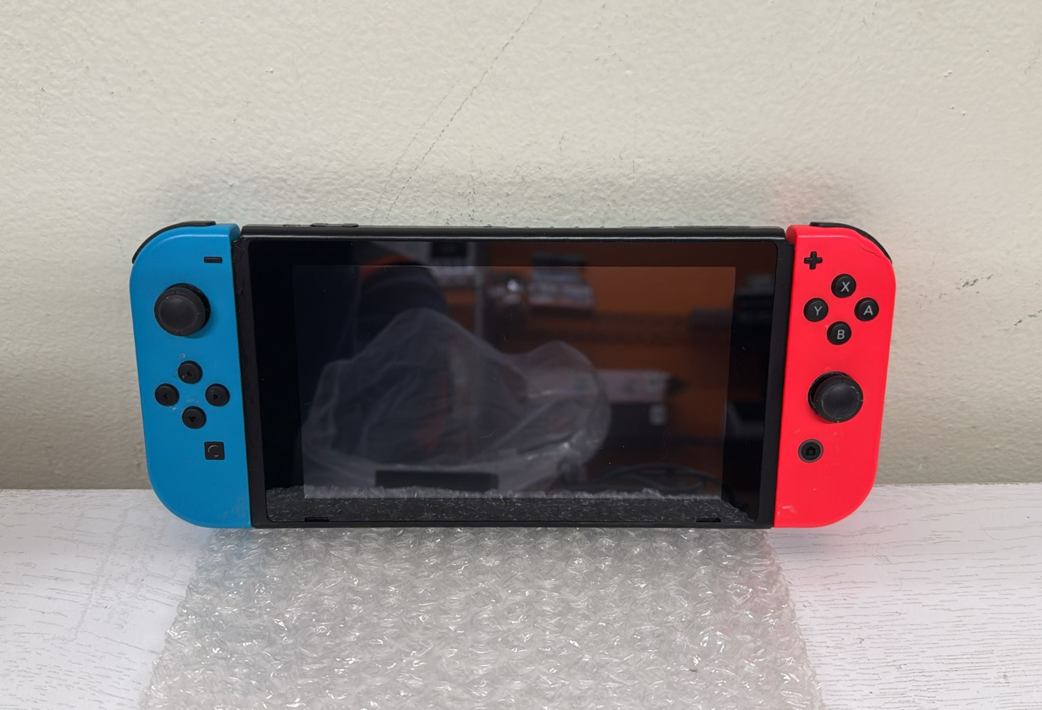 Nintendo Switch with Neon Blue and Neon Red Joy‑Con