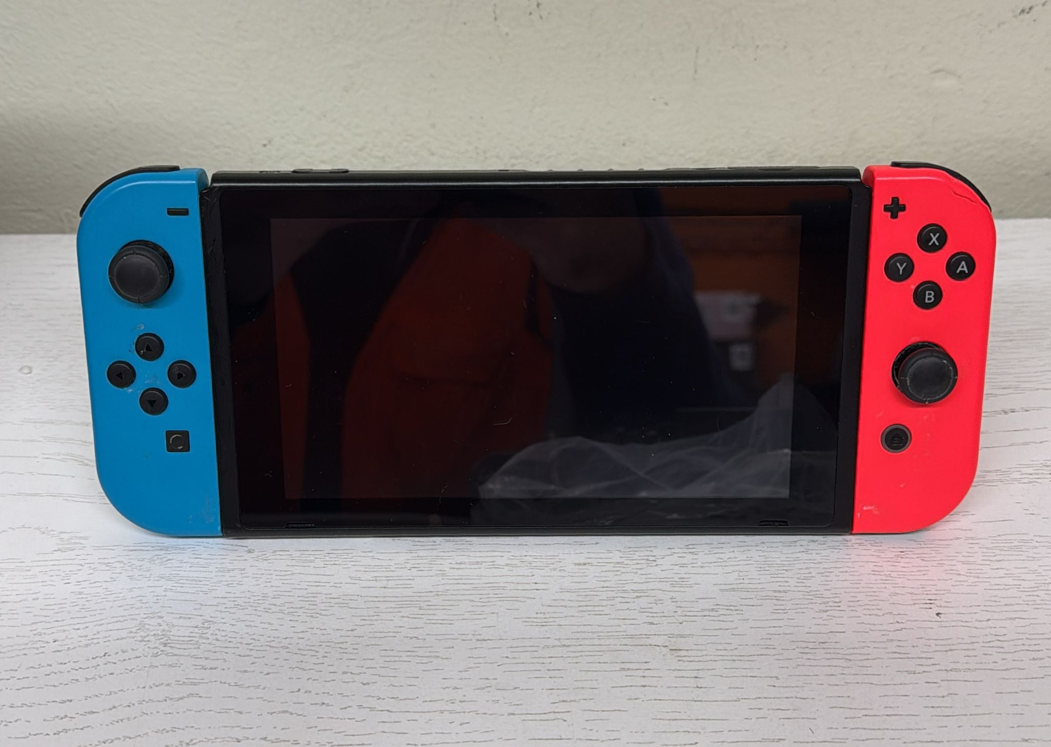 Nintendo Switch with Neon Blue and Neon Red Joy‑Con