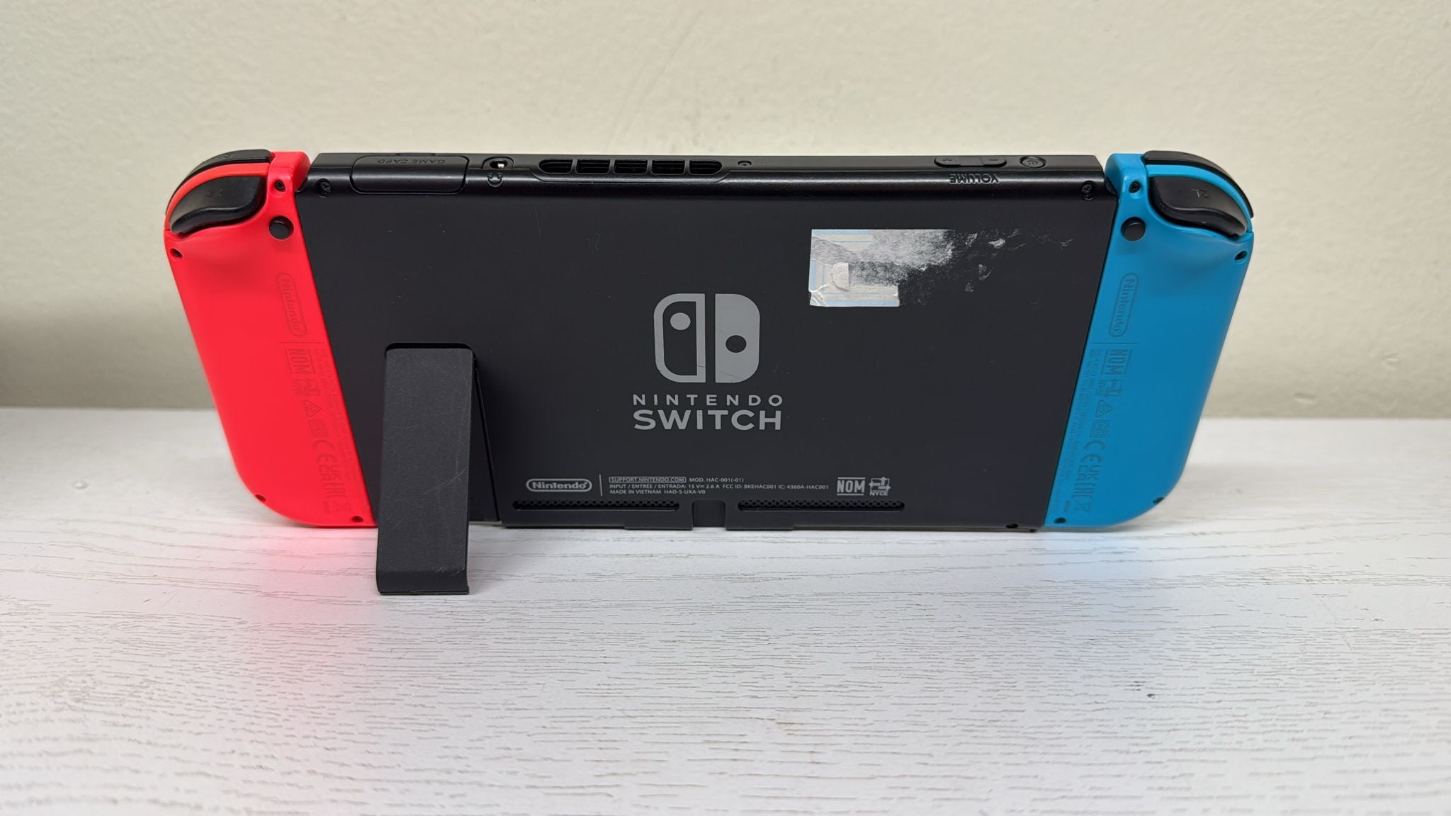 Nintendo Switch with Neon Blue and Neon Red Joy‑Con