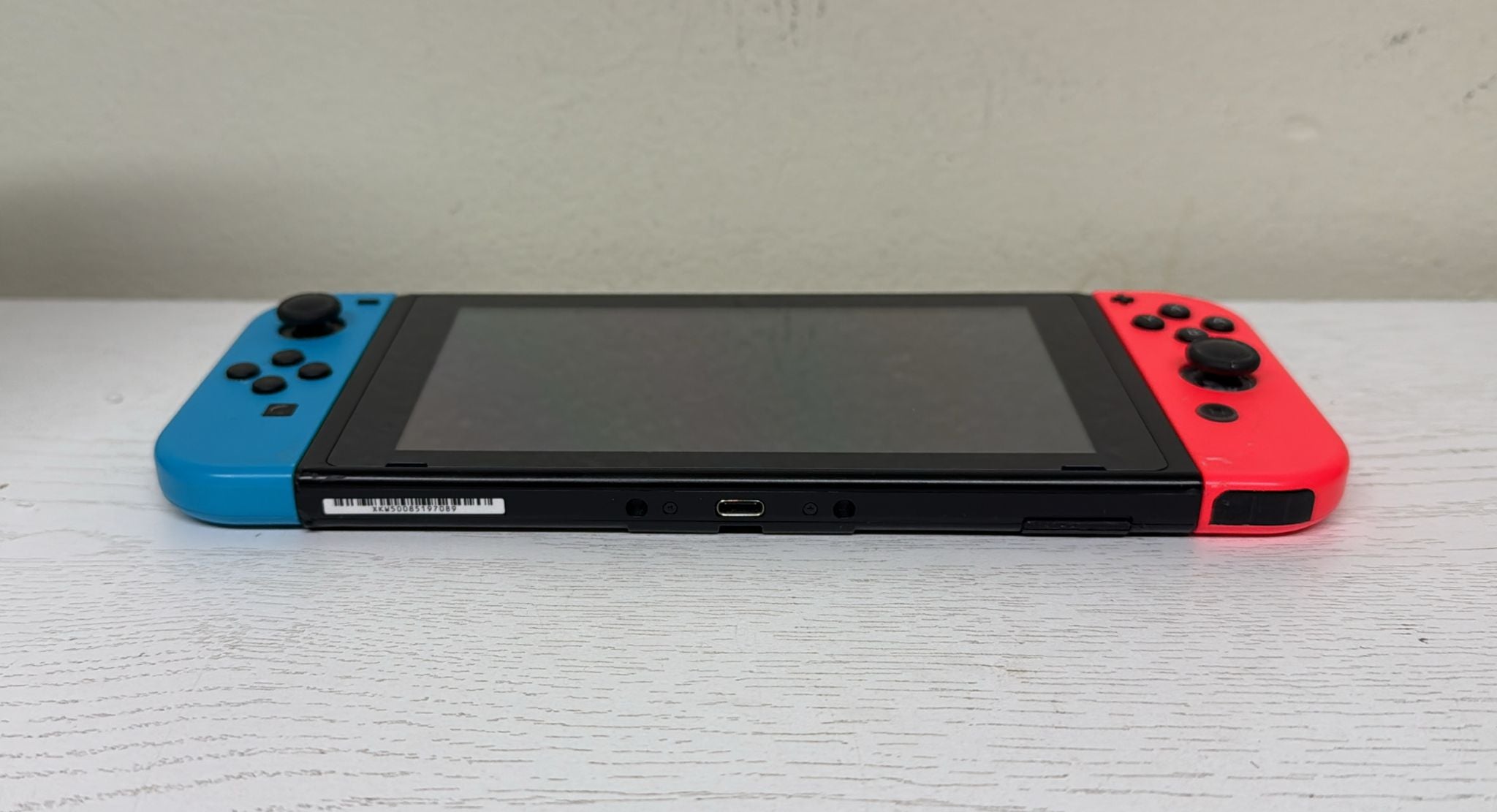 Nintendo Switch with Neon Blue and Neon Red Joy‑Con